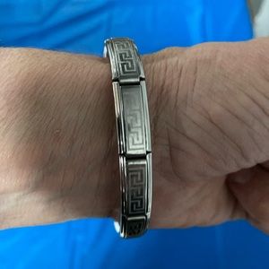 Versace stain steel expandable bracelet . Fits all . Good condition .